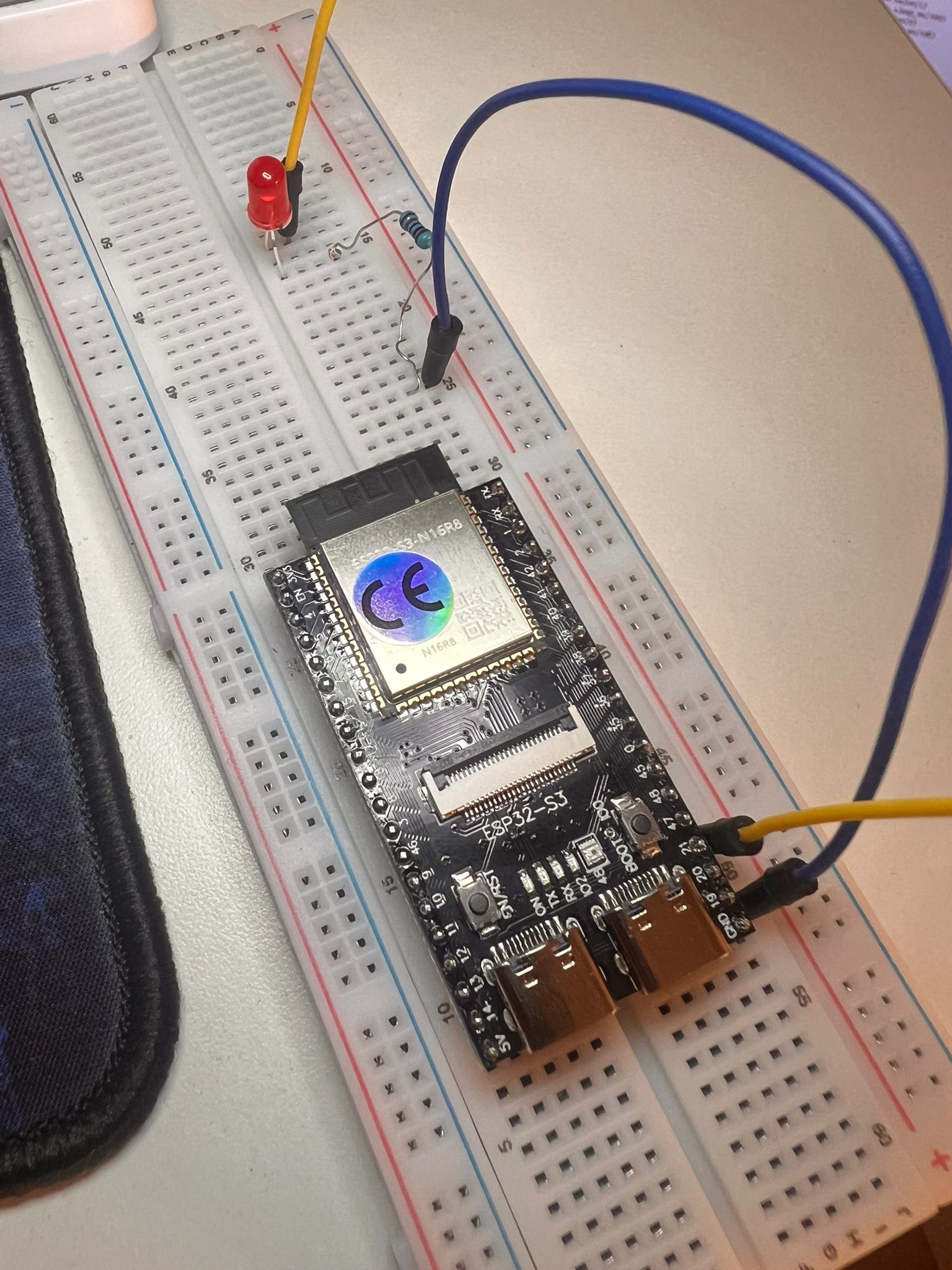 ESP32 S3 microcontroller connected to LED on breadboard for blinking LED project